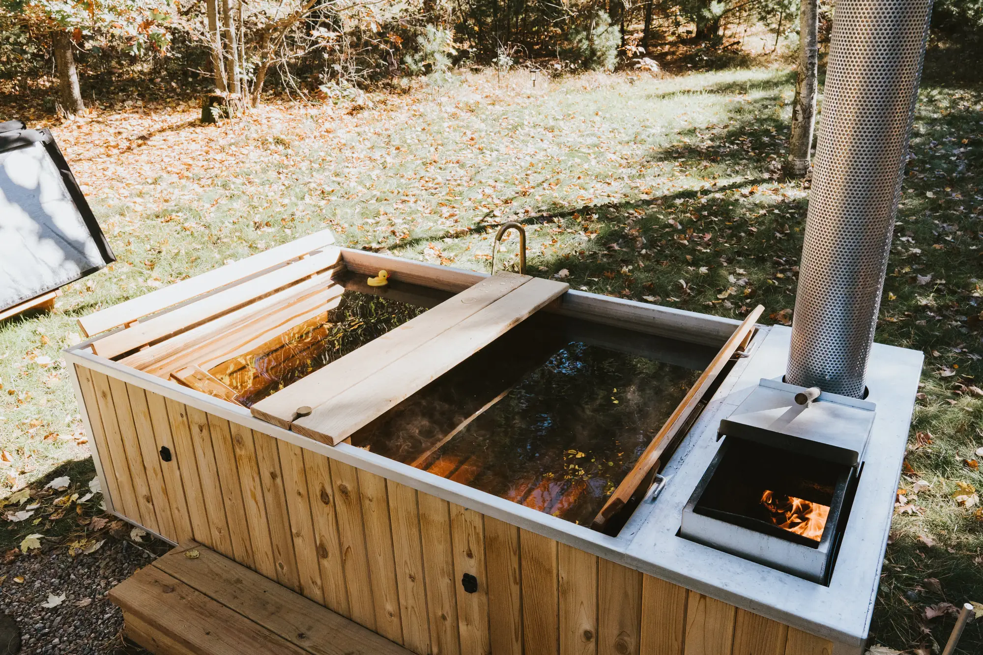 Cedar hot tub with its wood fire lit