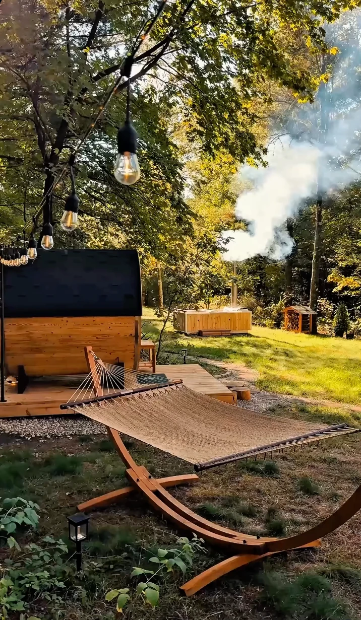 Barrel sauna, hammock and wood-fired hot tub in the garden